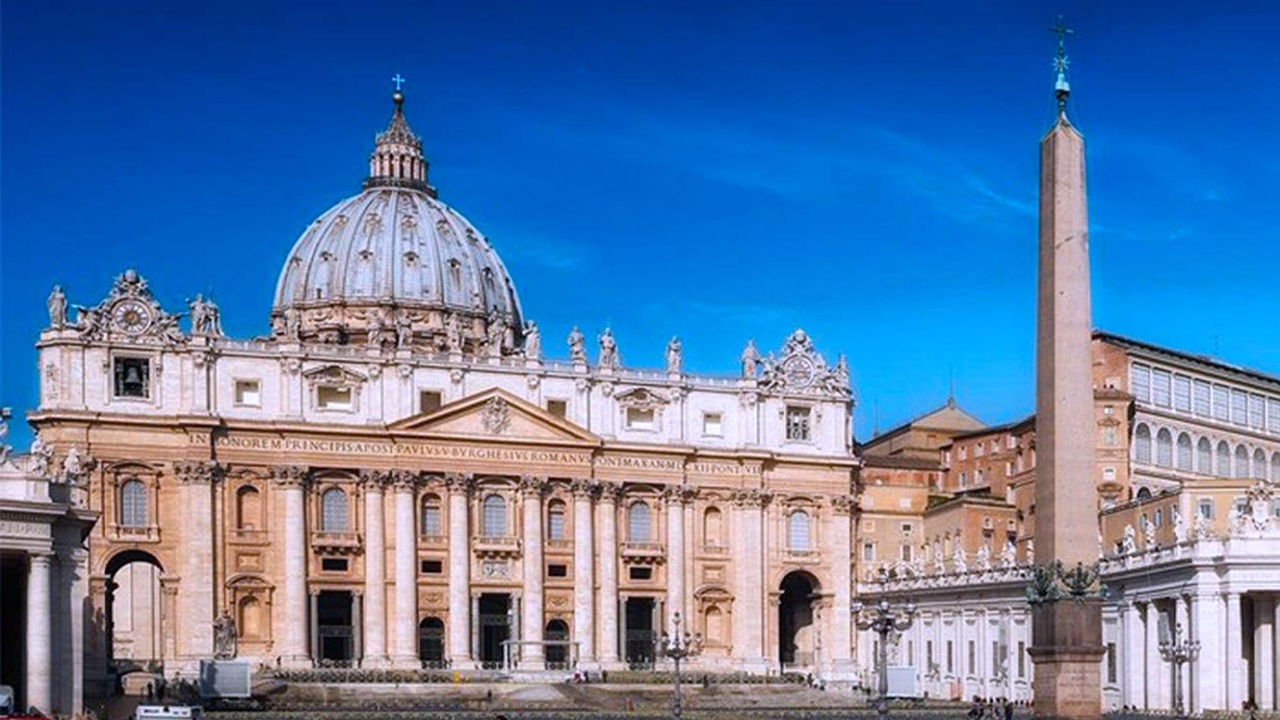 The image shows the façade of St. Peter's Basilica with its iconic dome and surrounding structures.